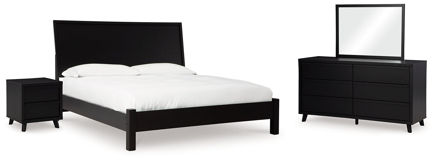 Danziar King Panel Bed with Mirrored Dresser and Nightstand