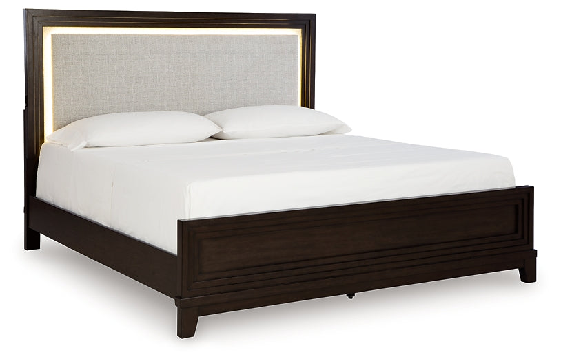 Neymorton California King Upholstered Panel Bed with Mirrored Dresser and Nightstand